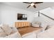 Bright and modern living room with hardwood floors, comfortable seating, and a media cabinet at 117 Osprey Ridge Ln, Summerville, SC 29483
