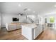 Open-concept living space with a kitchen island and comfortable seating area at 117 Osprey Ridge Ln, Summerville, SC 29483