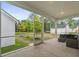 Relaxing screened-in patio with comfortable seating and views of the lush backyard at 117 Osprey Ridge Ln, Summerville, SC 29483