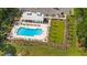 Aerial view of the community pool with lounge area, lush greenery, and manicured landscaping at 117 Osprey Ridge Ln, Summerville, SC 29483