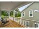 Covered porch with wooden floor, white railings, and comfortable outdoor seating at 117 Osprey Ridge Ln, Summerville, SC 29483