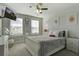 Bright bedroom with a white bed frame, wall decor, a ceiling fan, and natural light at 1209 Hammrick Ln, Johns Island, SC 29455