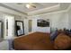 Cozy bedroom featuring a large bed, bedside tables, a ceiling fan, and a large dresser at 1209 Hammrick Ln, Johns Island, SC 29455