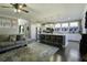 Open-concept living room features a spacious layout, modern kitchen island, and stylish decor at 1209 Hammrick Ln, Johns Island, SC 29455