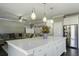 Bright kitchen featuring a large island with seating, opening to a comfortable living space at 1209 Hammrick Ln, Johns Island, SC 29455