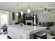 Open floor plan showcases a kitchen island and cozy living area at 1209 Hammrick Ln, Johns Island, SC 29455