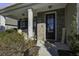 Cozy front porch featuring a brick facade, decorative plants, and a welcoming atmosphere at 1209 Hammrick Ln, Johns Island, SC 29455