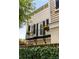 Charming balcony with black railings, flower boxes, and lush greenery surrounding the property at 121 W Shipyard Rd, Mount Pleasant, SC 29464
