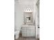 A serene bathroom with a vanity with marble top, chrome fixtures, and a large mirror at 121 W Shipyard Rd, Mount Pleasant, SC 29464