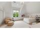 Bright bedroom with white carpet, furniture, and walls has a large window with an outside view at 121 W Shipyard Rd, Mount Pleasant, SC 29464