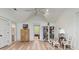 Open bonus room with multiple seating areas, light wood floors, and lots of natural light at 121 W Shipyard Rd, Mount Pleasant, SC 29464