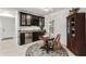 A cozy dining area with black built-in cabinets, a small round table, and a decorative area rug at 121 W Shipyard Rd, Mount Pleasant, SC 29464