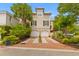 Charming two-story home with white trim, a two-car garage, and beautiful landscaping at 121 W Shipyard Rd, Mount Pleasant, SC 29464