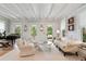 Bright living room with beamed ceilings, large windows, and cozy seating at 121 W Shipyard Rd, Mount Pleasant, SC 29464