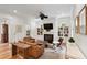 Comfortable living room with fireplace, built-in shelving, and a ceiling fan at 121 W Shipyard Rd, Mount Pleasant, SC 29464