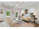 Inviting living room features beamed ceilings, natural light, and elegant furnishings at 121 W Shipyard Rd, Mount Pleasant, SC 29464