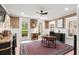 Bright office space with white trim, grasscloth wallpaper, hardwood desk, and lots of natural light at 121 W Shipyard Rd, Mount Pleasant, SC 29464