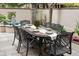 Outdoor dining area with seating for eight, featuring a water feature, and walled garden at 121 W Shipyard Rd, Mount Pleasant, SC 29464