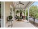 Relaxing porch featuring a seating area with views of the beautifully landscaped yard at 121 W Shipyard Rd, Mount Pleasant, SC 29464