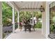 Charming porch with outdoor dining space, ideal for entertaining or relaxing at 121 W Shipyard Rd, Mount Pleasant, SC 29464