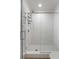 Modern shower with white subway tile and clear glass door, complete with a sleek fixture and built-in caddy at 121 W Shipyard Rd, Mount Pleasant, SC 29464