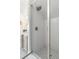 Glass shower with white subway tile and black and white patterned tile flooring at 121 W Shipyard Rd, Mount Pleasant, SC 29464