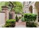 Manicured garden landscaping with brick walkway leading to a private entrance at 121 W Shipyard Rd, Mount Pleasant, SC 29464