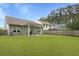 Spacious backyard with a covered patio, seating area, and a well-maintained lawn at 1221 Lois Allen Rd, Johns Island, SC 29455