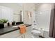 Well-lit bathroom featuring a tub and shower combination, vanity, framed mirror, and plush towels at 1221 Lois Allen Rd, Johns Island, SC 29455