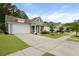 A gray, single-Gathering home with a two-car garage, an orange door, and a well-kept lawn at 1221 Lois Allen Rd, Johns Island, SC 29455