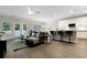 Open-concept living area featuring a comfortable sofa, modern décor, and a seamless connection to the kitchen at 1221 Lois Allen Rd, Johns Island, SC 29455