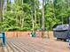 Well-maintained wooden deck with outdoor furniture and a barbecue grill, ideal for entertaining at 1325 Edward Dr, Moncks Corner, SC 29461