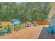 Lovely backyard with a wooden deck, a well-maintained lawn, and a charming blue shed at 1325 Edward Dr, Moncks Corner, SC 29461