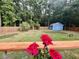Beautiful backyard with a shed, fire pit, and wooden fence providing privacy at 1325 Edward Dr, Moncks Corner, SC 29461