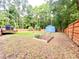 Spacious backyard with a shed, wooden fence, and garden area, perfect for outdoor activities at 1325 Edward Dr, Moncks Corner, SC 29461