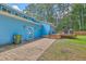 Home exterior showcasing a spacious yard, blue siding, and a delightful wooden deck at 1325 Edward Dr, Moncks Corner, SC 29461