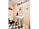 Quaint bathroom featuring unique checkered floors, a pedestal sink, and charming coastal decor at 1325 Edward Dr, Moncks Corner, SC 29461