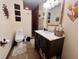 Well-appointed bathroom with a dark vanity, updated fixtures, and a tiled walk-in shower at 1325 Edward Dr, Moncks Corner, SC 29461
