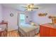 Calming bedroom with lilac walls, wood floors, and a ceiling fan at 1325 Edward Dr, Moncks Corner, SC 29461