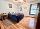Cozy bedroom with wood floors, a ceiling fan, natural lighting and a comfortable king bed at 1325 Edward Dr, Moncks Corner, SC 29461