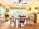 Cozy dining area with a ceiling fan and natural light streaming in from a sliding glass door to the backyard at 1325 Edward Dr, Moncks Corner, SC 29461