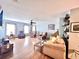 Inviting living room with comfortable seating, hardwood floors, and ample natural light from the surrounding windows at 1325 Edward Dr, Moncks Corner, SC 29461