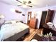 Serene bedroom with soft lavender walls, wood floors, and neutral bedding, creating a peaceful retreat at 1325 Edward Dr, Moncks Corner, SC 29461