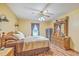 Cozy main bedroom with wood flooring, ceiling fan, and abundant natural light at 1325 Edward Dr, Moncks Corner, SC 29461