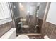 Bathroom with a tiled shower, toilet, and dark floors at 133 Tall Spruce Rd, Moncks Corner, SC 29461