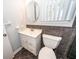 Bathroom with a vanity, round mirror, and gray tile at 133 Tall Spruce Rd, Moncks Corner, SC 29461
