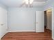 Bedroom showcases two doors, a ceiling fan, and neutral paint, with wood-look floors for easy maintenance at 133 Tall Spruce Rd, Moncks Corner, SC 29461