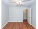 Well-lit bedroom featuring wood-look flooring, ceiling fan, and a closet for ample storage at 133 Tall Spruce Rd, Moncks Corner, SC 29461
