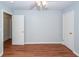Large bedroom with wood-look floors, neutral walls, ceiling fan and convenient access to two closets at 133 Tall Spruce Rd, Moncks Corner, SC 29461