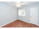 Bright bedroom features a ceiling fan, wood-look floors, and ample natural light from the window at 133 Tall Spruce Rd, Moncks Corner, SC 29461